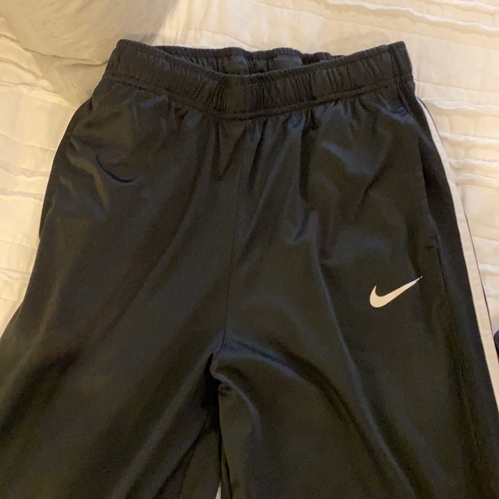 EUC - Boys XL polyester pants.   Black with white stripe.   Barely worn